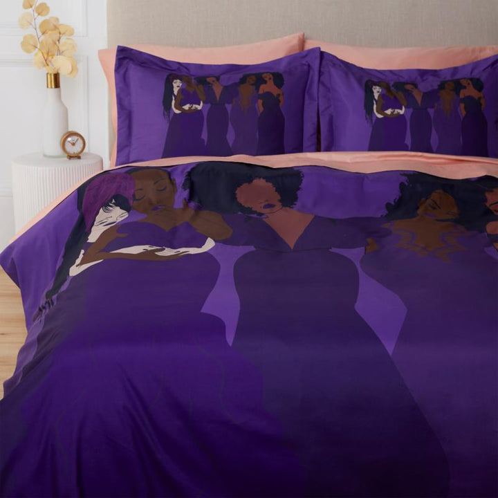 Harmony Duvet Cover & Pillow Sham Set by Pardon My Fro on bed – 5 Black women in purple dresses on royal purple | Especially Yours